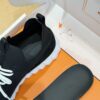 7 Hermès Black Knit and Suede Low-Top Sneakers with White Laces and Treaded Sole