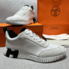 ScreenShot_2026-06-09_204431_306 Hermès White Leather & Suede Low-Top Sneakers with Black H Logo Sole