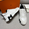 ScreenShot_2026-06-09_204512_969 Hermès White Leather & Suede Low-Top Sneakers with Black H Logo Sole