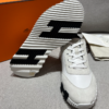 ScreenShot_2026-06-09_204530_071 Hermès White Leather & Suede Low-Top Sneakers with Black H Logo Sole